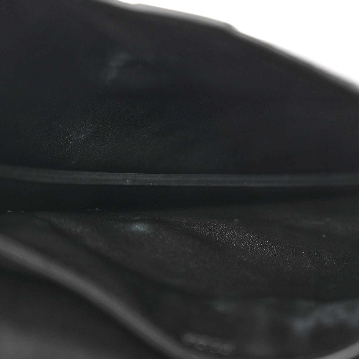 X KAWS Grained Calfskin Saddle Wristlet Black