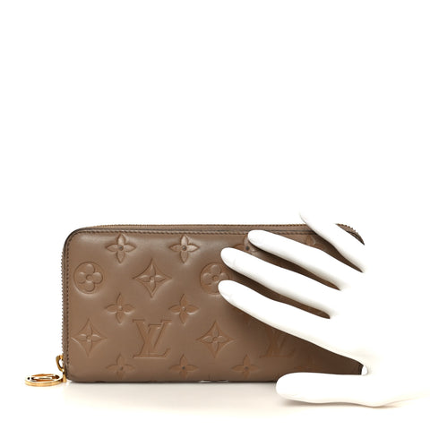 Lambskin Embossed Monogram Coussin Zippy Wallet Taupe