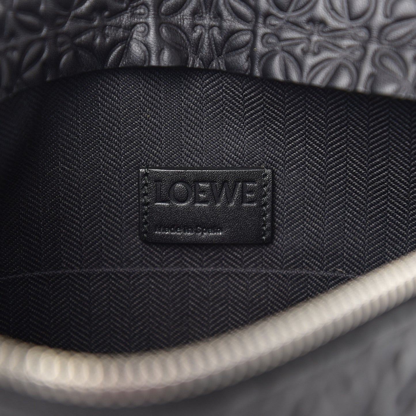 Calfskin Embossed Repeat T Pouch Black