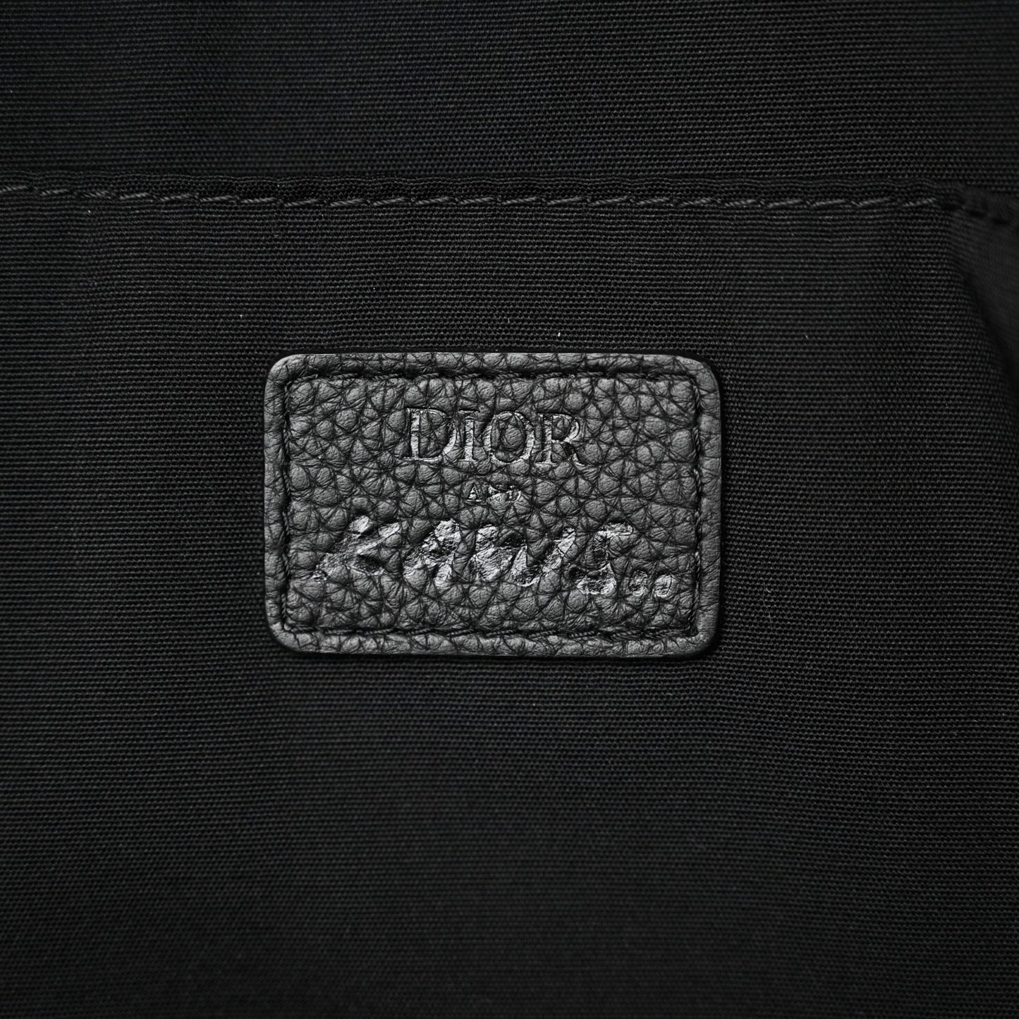 X KAWS Nylon Calfskin Logo Backpack Black