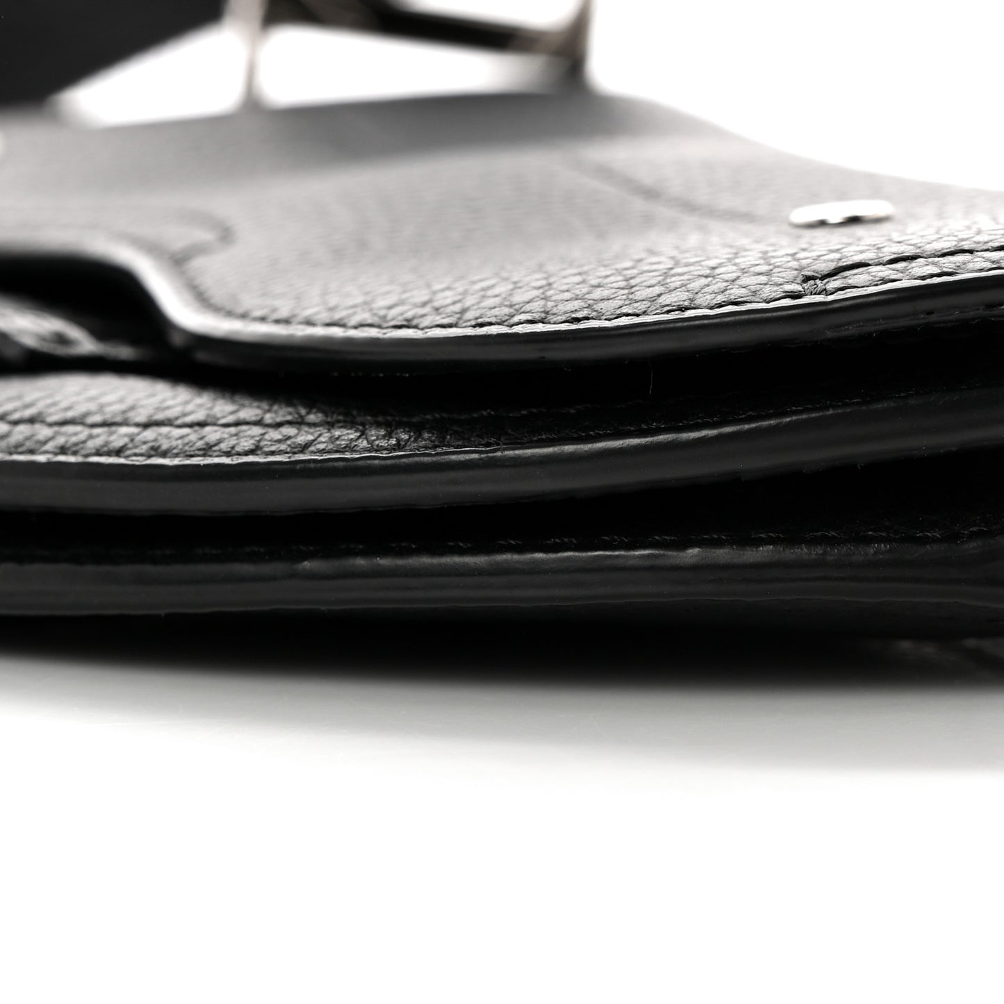 X KAWS Grained Calfskin Saddle Wristlet Black