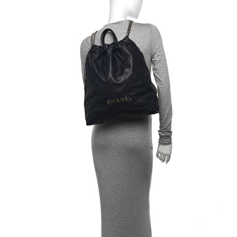 Shiny Caviar Quilted Chanel 22 Backpack Dark Blue