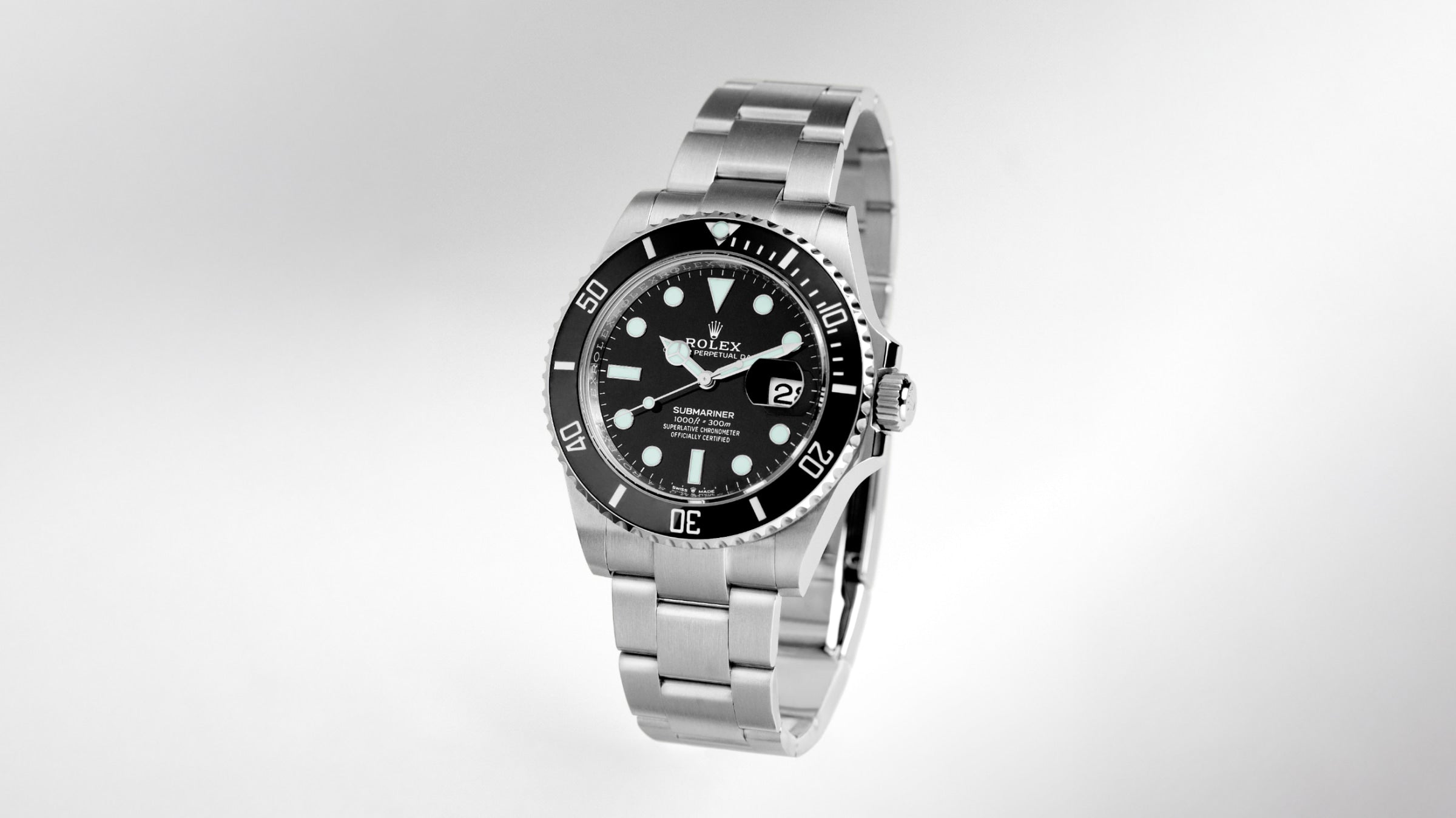 Rolex Submariner Date stainless steel watch with a black dial and matching black ceramic bezel