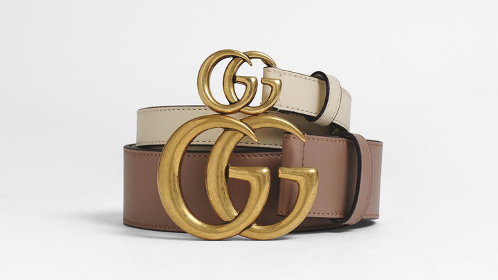 A stack of two Gucci belts with a GG buckle