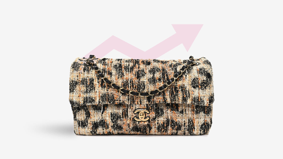 A Chanel Tweed Mixed Fibers Leopard Print Small Souplissimo Maxi Flap Brown Black White with a pink arrow pointing up