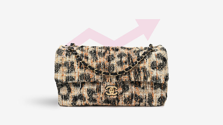 A Chanel Tweed Mixed Fibers Leopard Print Small Souplissimo Maxi Flap Brown Black White with a pink arrow pointing up