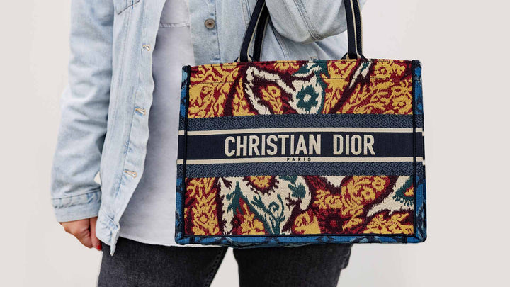 lifestyle image of paisley christian dior book tote FASHIONPHILE