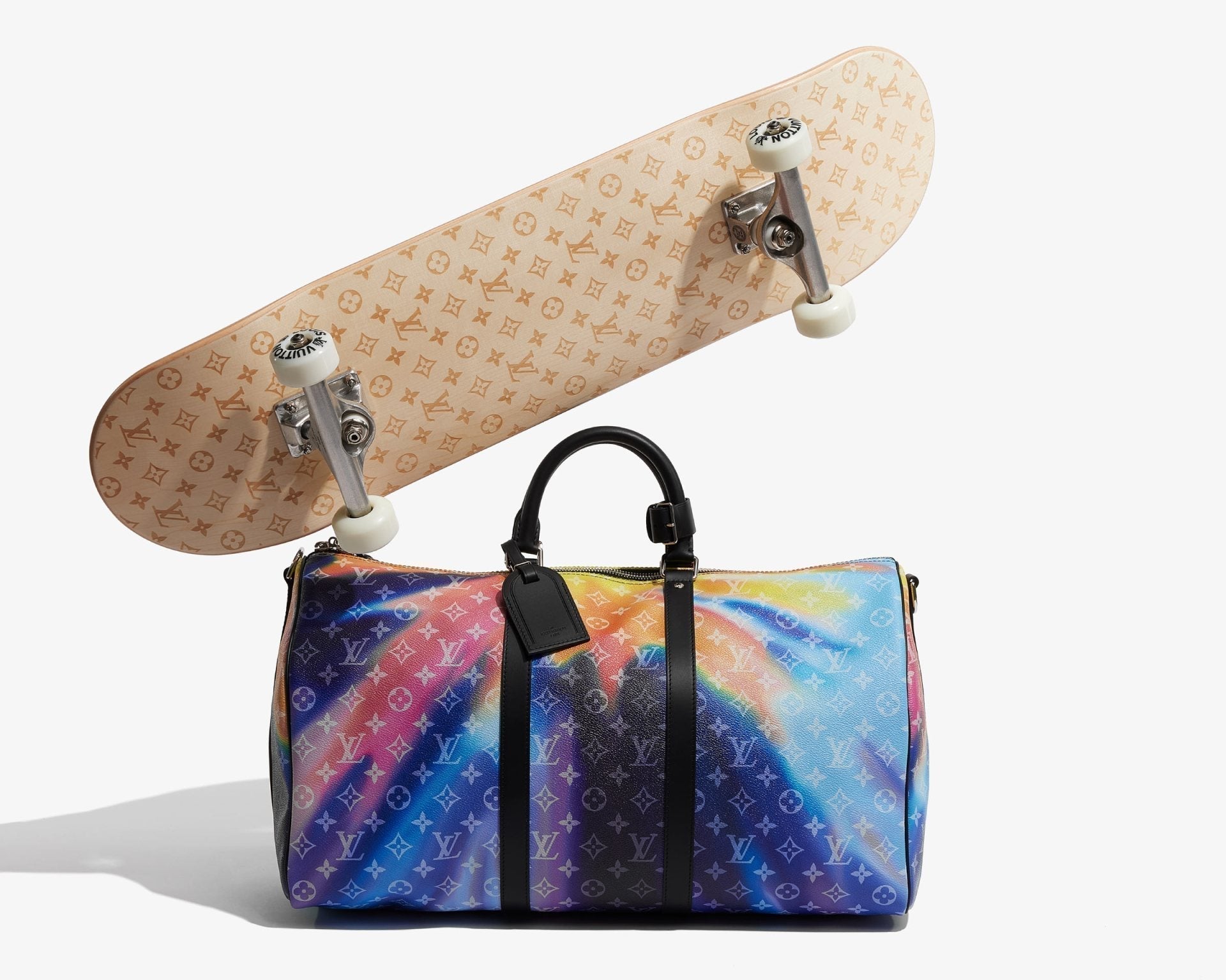 studio image of Louis Vuitton Monogram Sunset Keepall and monogram skateboard FASHIONPHILE