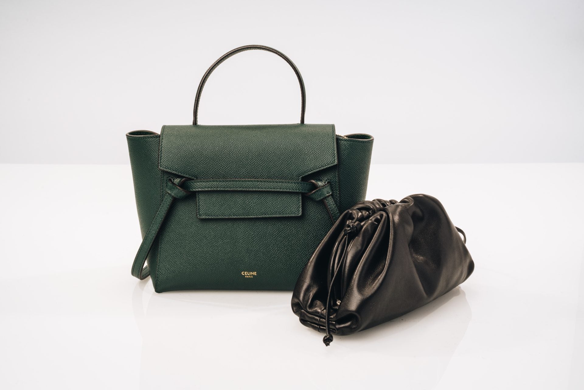 studio image of celine belt bag and bottega veneta pouch bag FASHIONPHILE