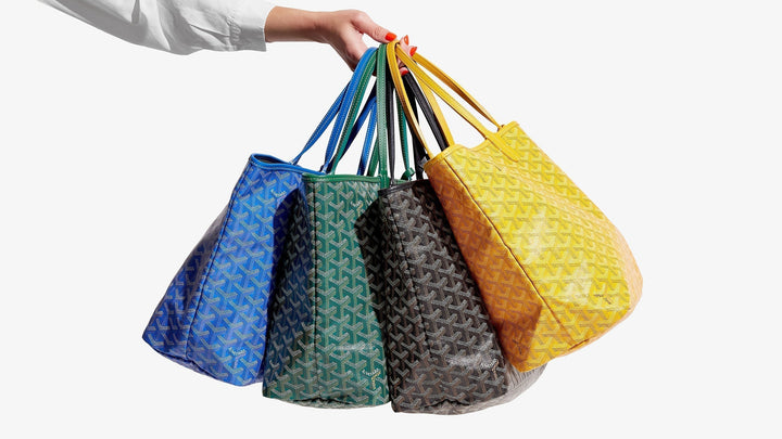 lifestyle image of multiple goyard saint louis tote bags carried in one hand FASHIONPHILE