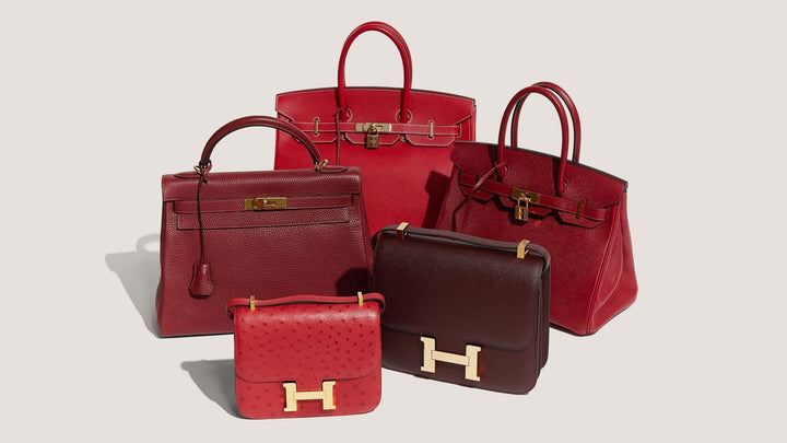 studio image of Hermes red bags grouped together FASHIONPHILE