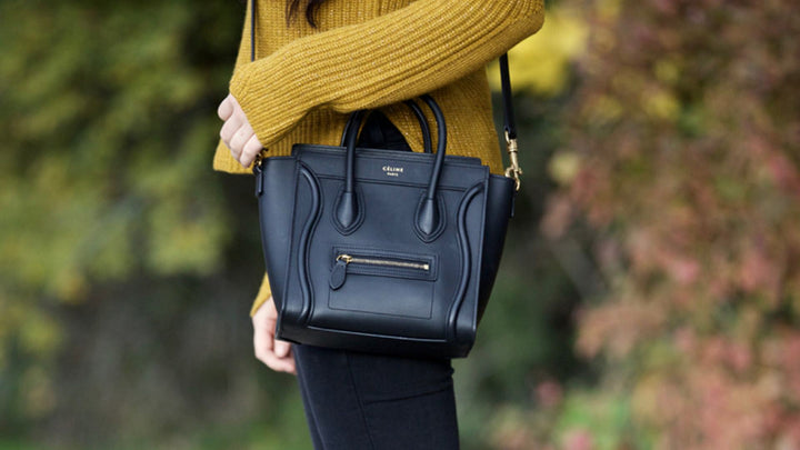 lifestyle image of model wearing black celine nano luggage tote FASHIONPHILE