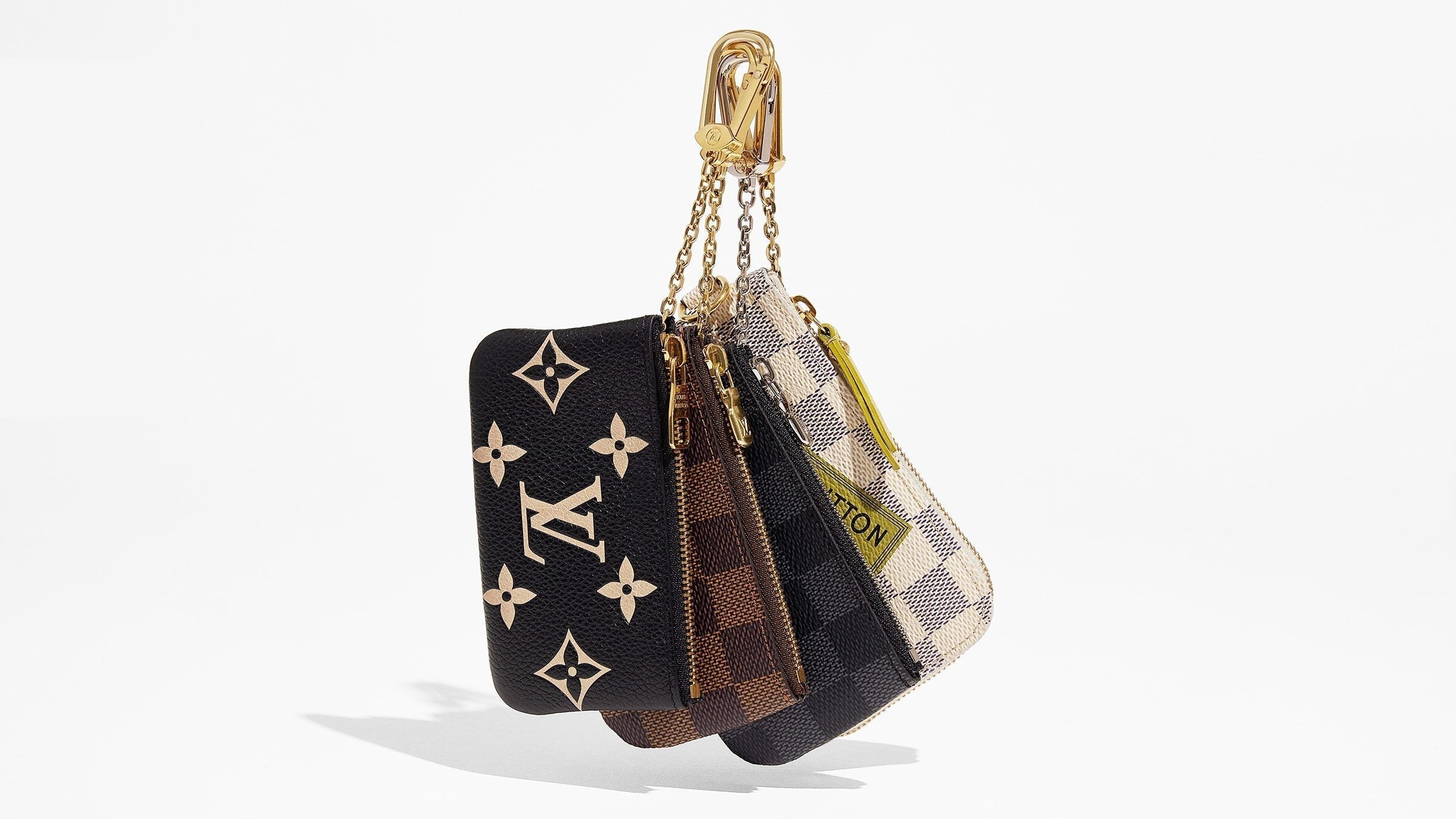 product image of Louis Vuitton Key Pouches hanging together FASHIONPHILE