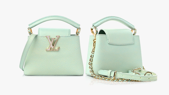 image of a Louis Vuitton Capucines bag in light mint green color by FASHIONPHILE
