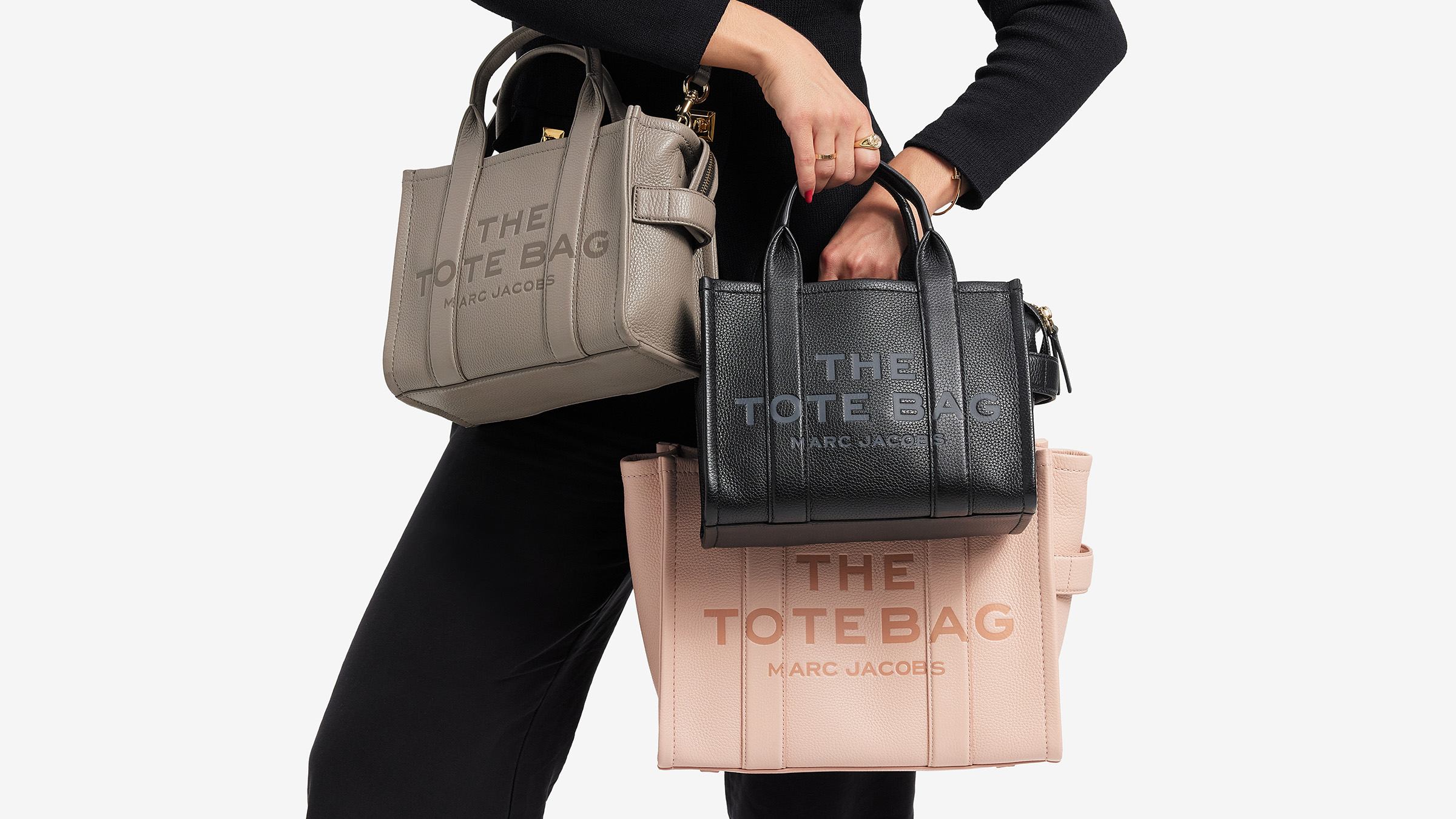 comparing sizes of three marc jacobs the tote bags in different colors and sizes