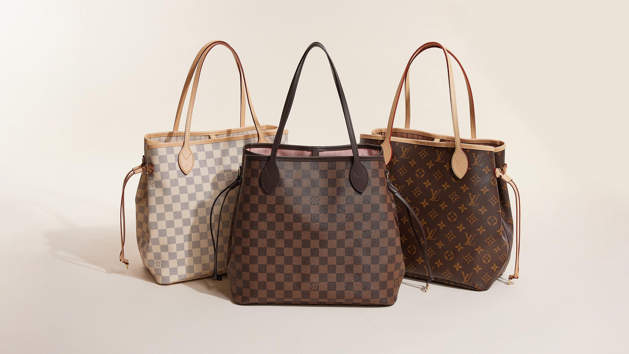 Studio image of Louis Vuitton neverfull bags grouped together FASHIONPHILE