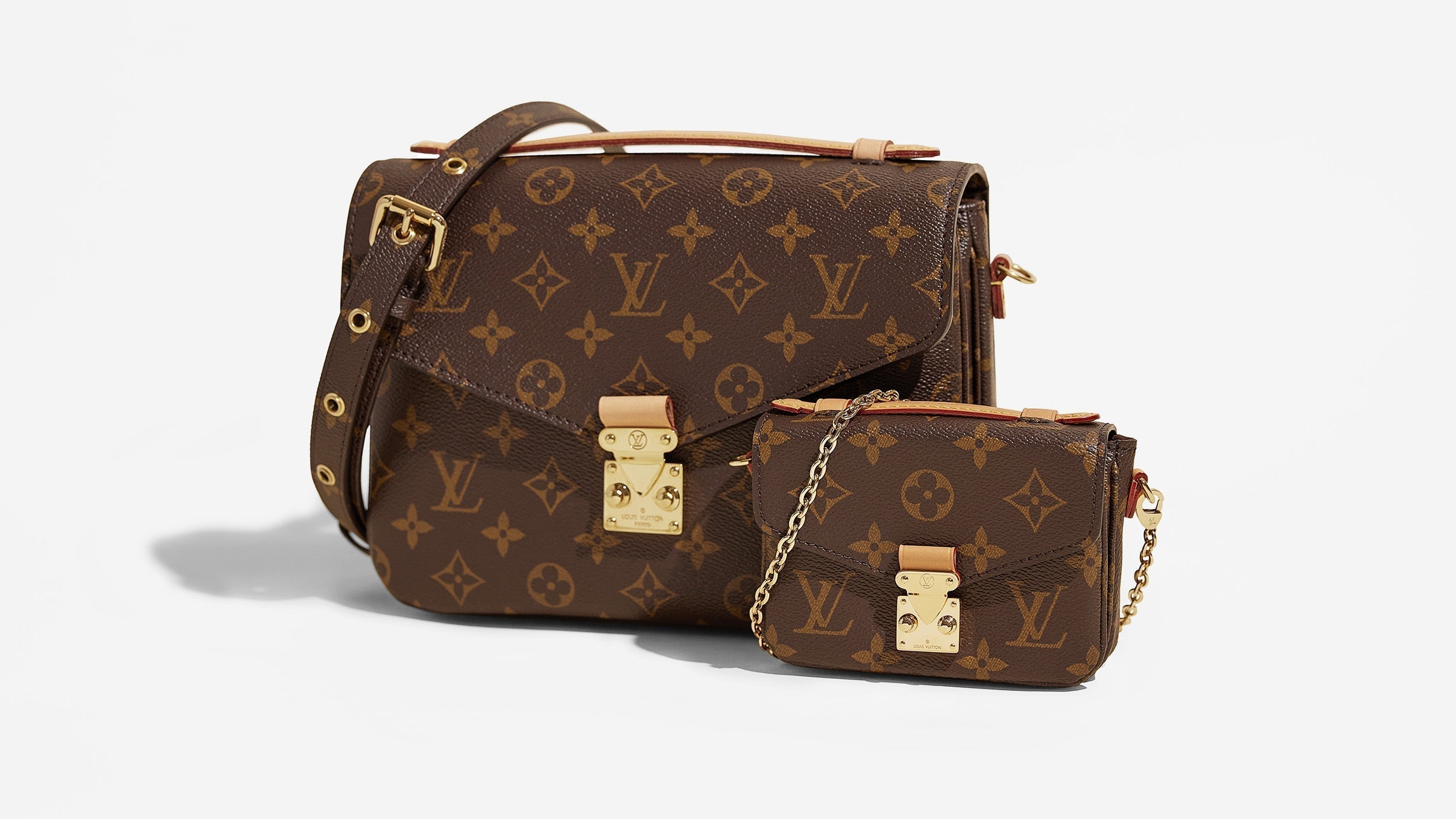studio image of louis vuitton pochette metis and micro metis side by side FASHIONPHILE