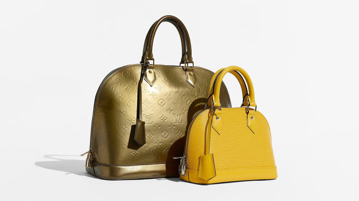 A size comparison of the Louis Vuitton Alma GM with the Alma BB side by side by FASHIONPHILE