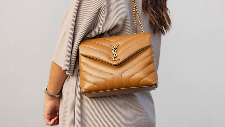 lifestyle image of model wearing saint laurent loulou chain satchel bag FASHIONPHILE