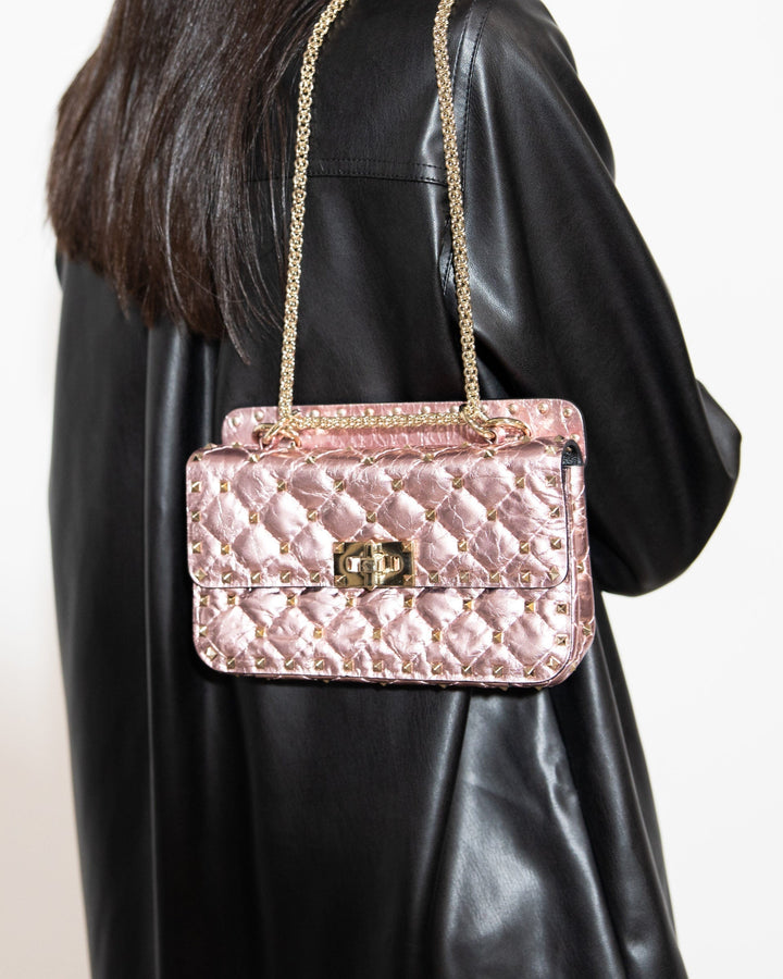 model wearing metallic valentino rockstud bag FASHIONPHILE