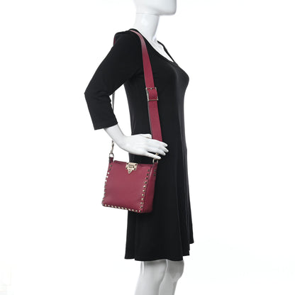 Valentino Garavani Pebbled Calfskin Mini Rockstud Flip-Lock Messenger Bag Raspberry 2 of 8