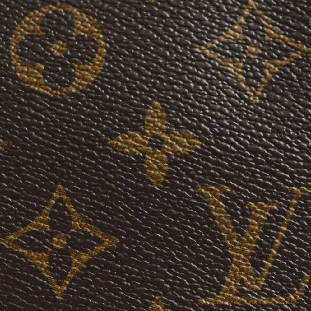 The leaf tab of a Louis Vuitton Speedy up close