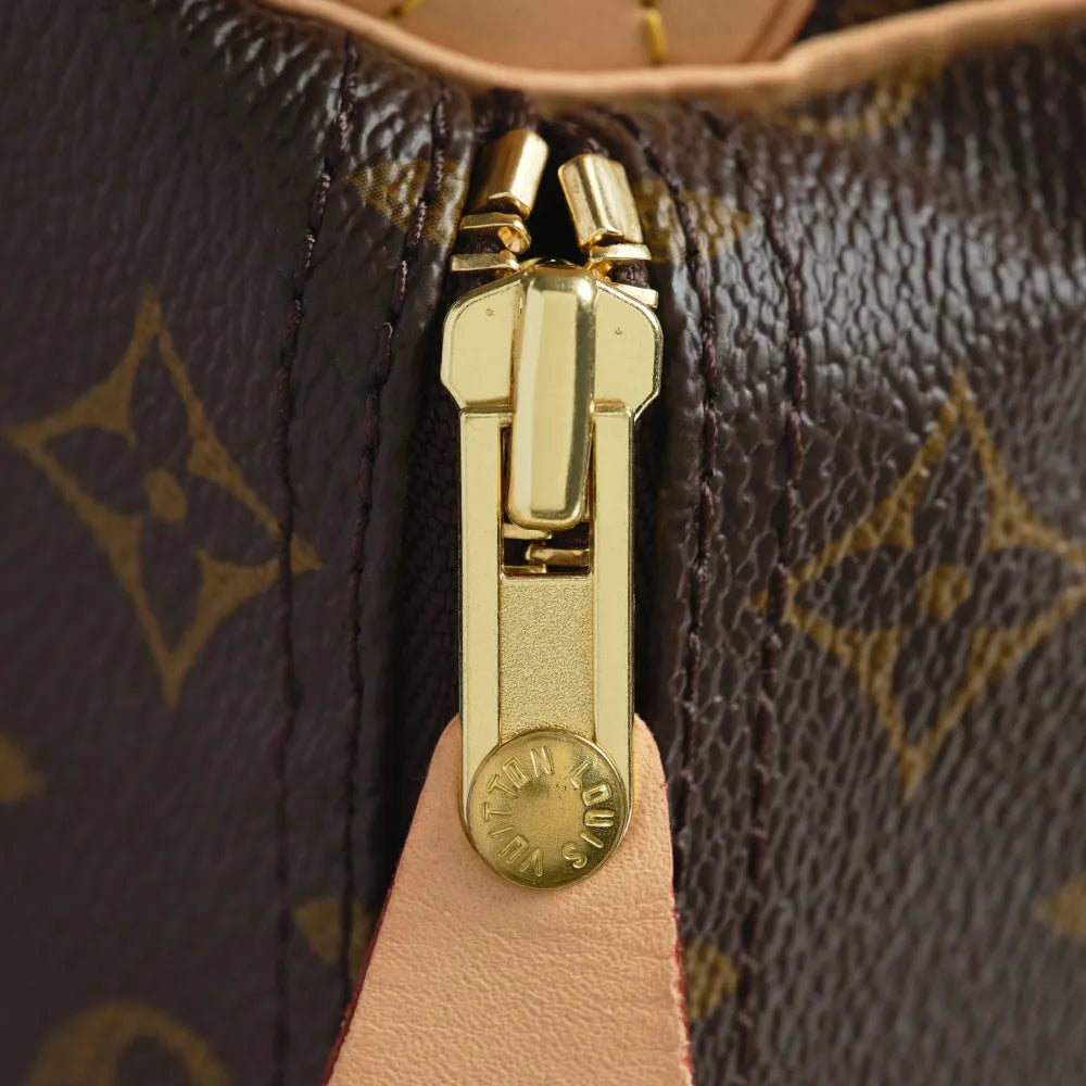 The zipper pull on an authentic Louis Vuitton Speedy