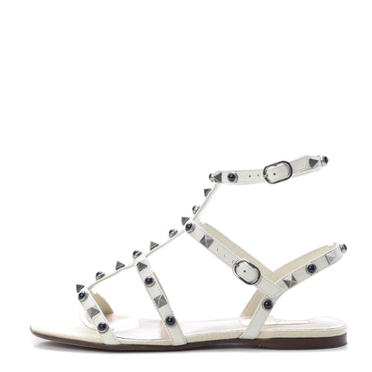 Valentino Garavani Calfskin Onyx Rockstud Rolling Gladiator Flat Sandals 36.5 Light Ivory 1 of 11