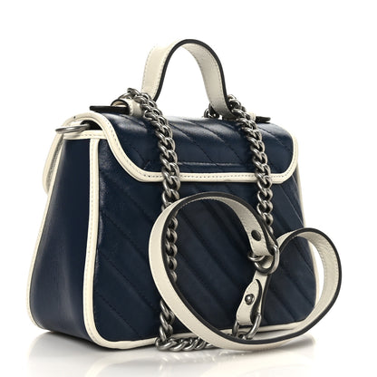 Gucci Vintage Effect Calfskin Matelasse Diagonal Mini Torchon GG Marmont Top Handle Shoulder Bag Blue Agata Mystic White 1 of 9