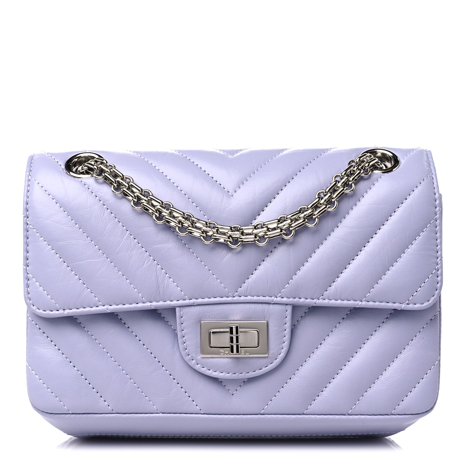 this is an image of a CHANEL Aged Calfskin Chevron Quilted 2.55 Reissue Mini Flap bag in the color Light Purple by FASHIONPHILE