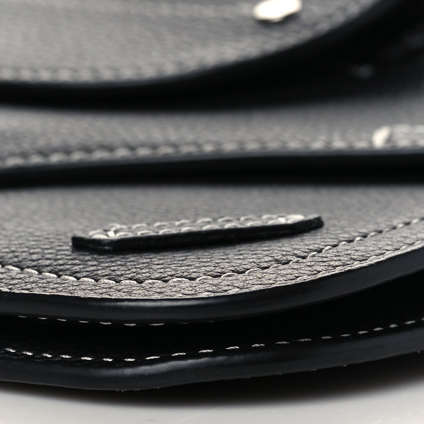 X KAWS Grained Calfskin Saddle Wristlet Black