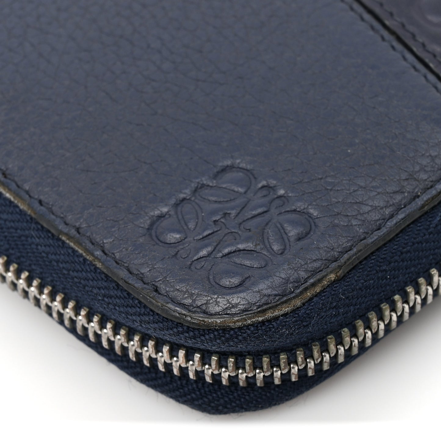 Calfskin Embossed Repeat Puzzle Zip Around Wallet Blue
