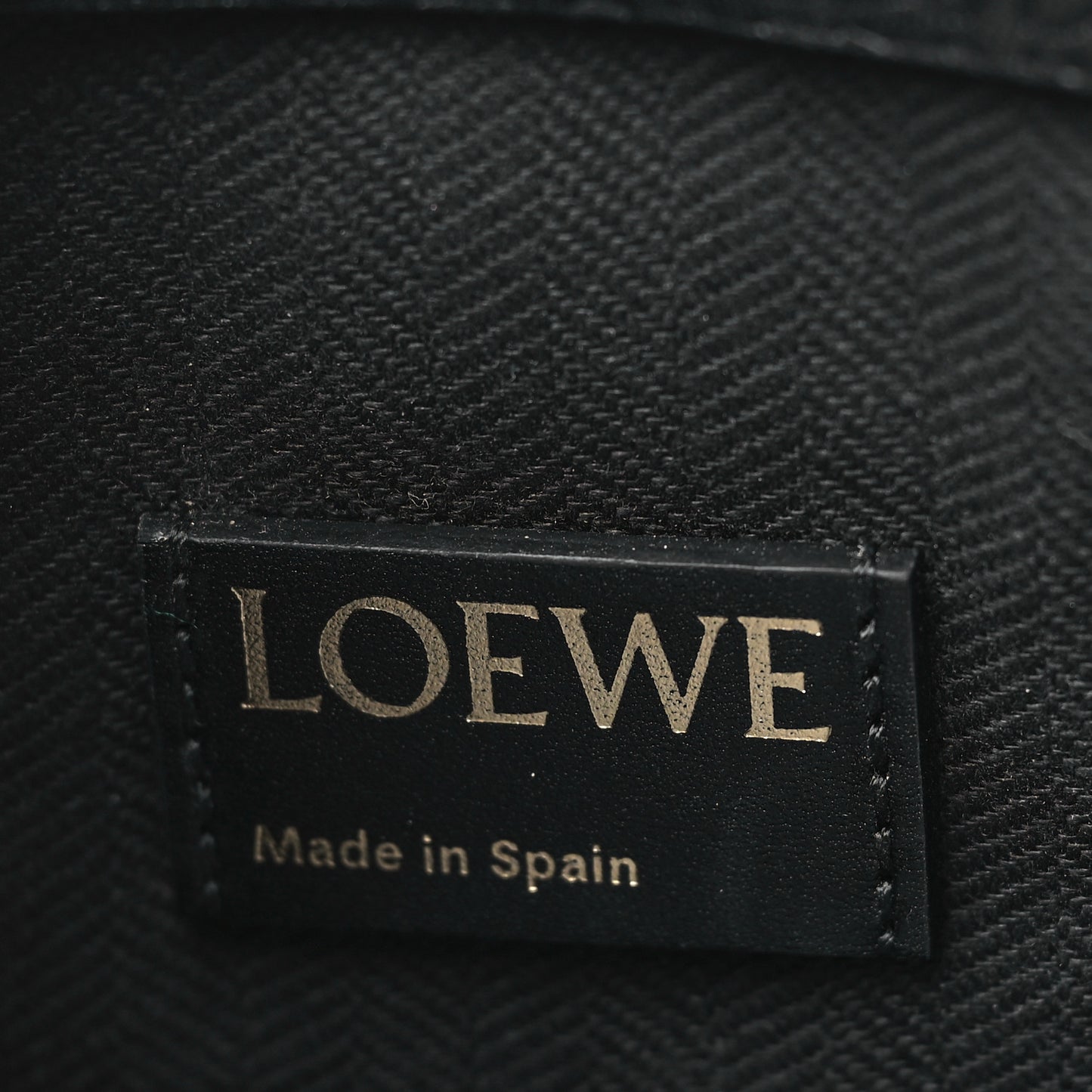 Calfskin Embossed Repeat T Pouch Black