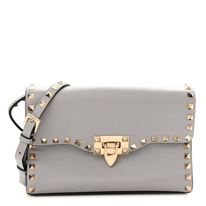 Valentino Garavani Pebbled Calfskin Medium Rockstud Flip Lock Crossbody Bag Pastel Grey 1 of 12