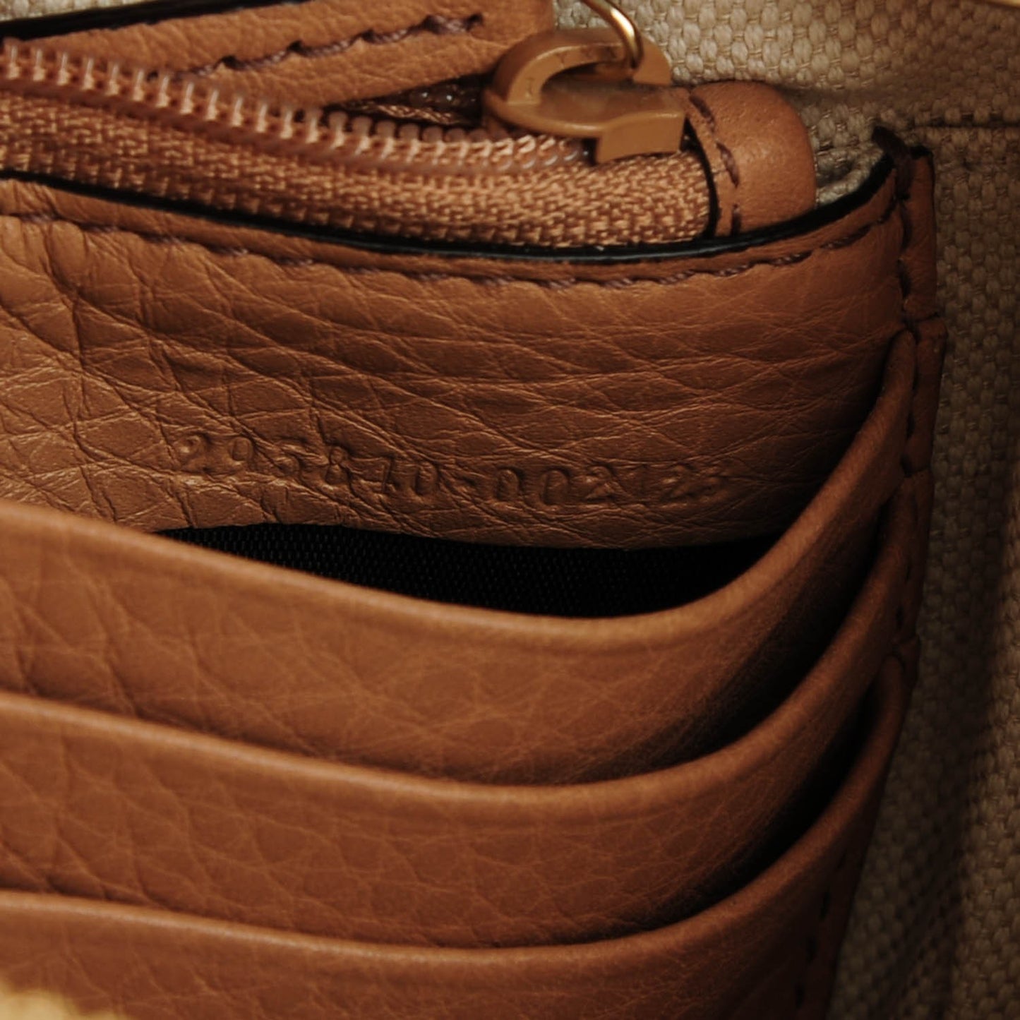 Pebbled Calfskin Soho Wristlet Camelia