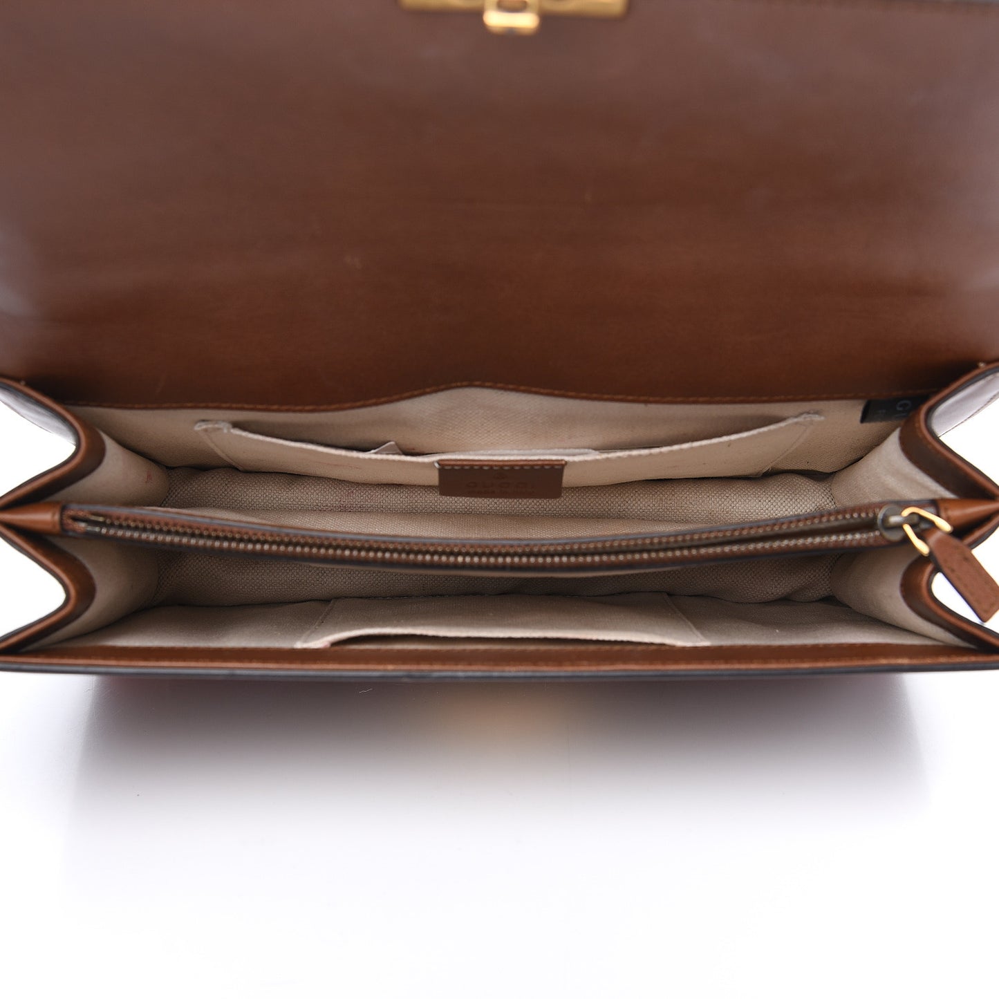 Calfskin Medium Cat Lock Top Handle Bag Brown