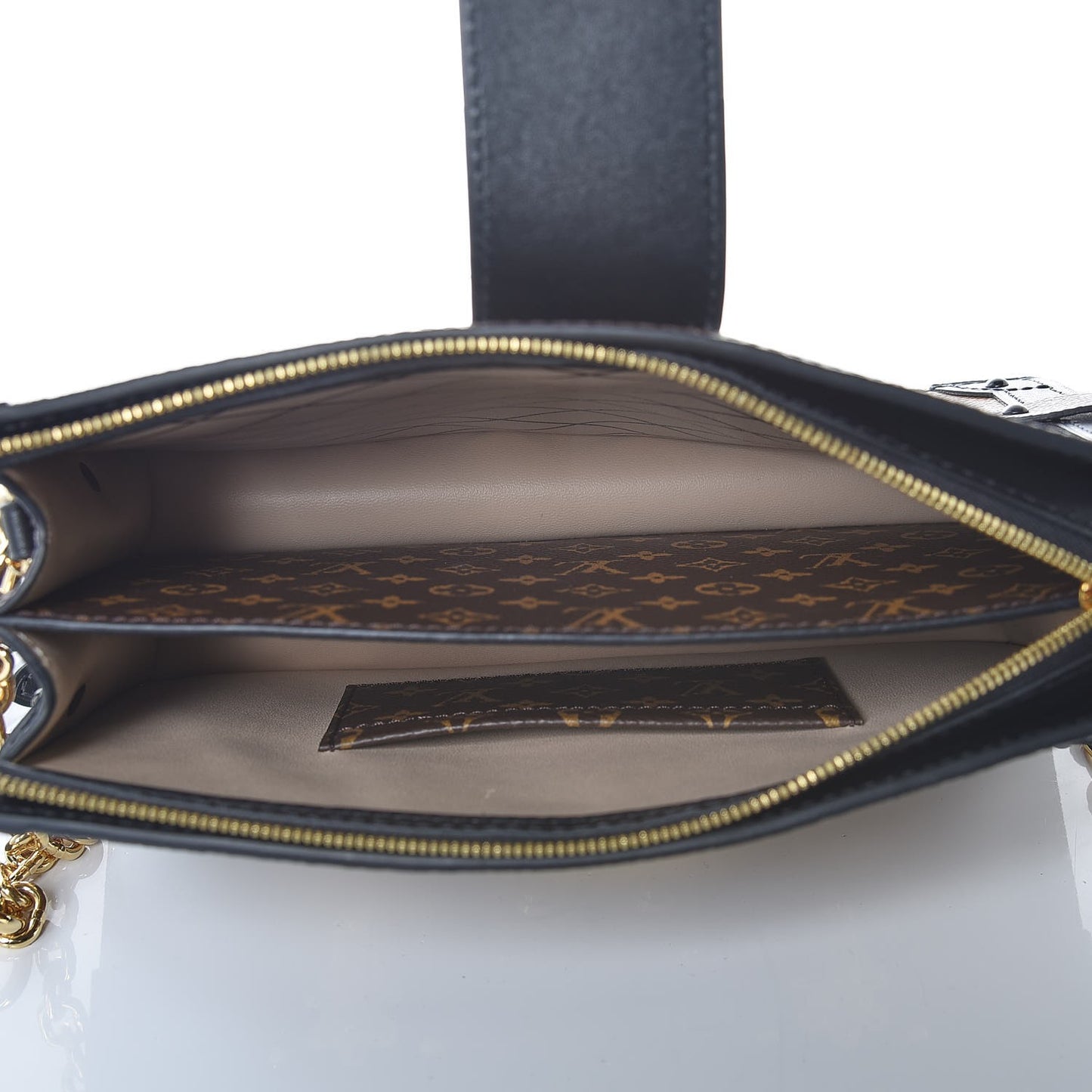 Reverse Monogram Trunk Clutch