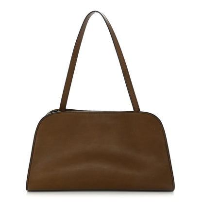 The Row Polished Saddle Calfskin Peggy Clutch Dark Muschio 1 of 10