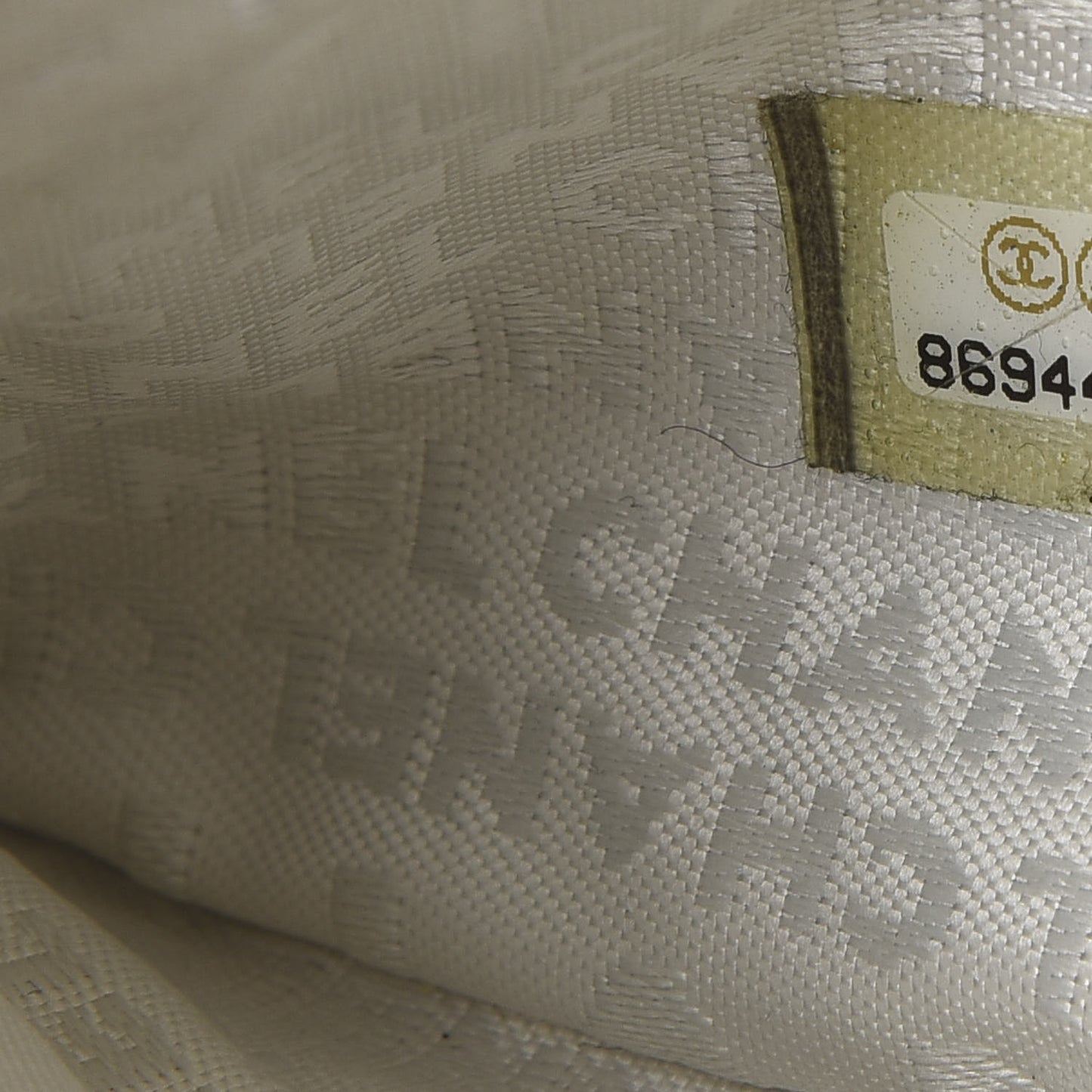 Lambskin Camellia Embossed Pochette White