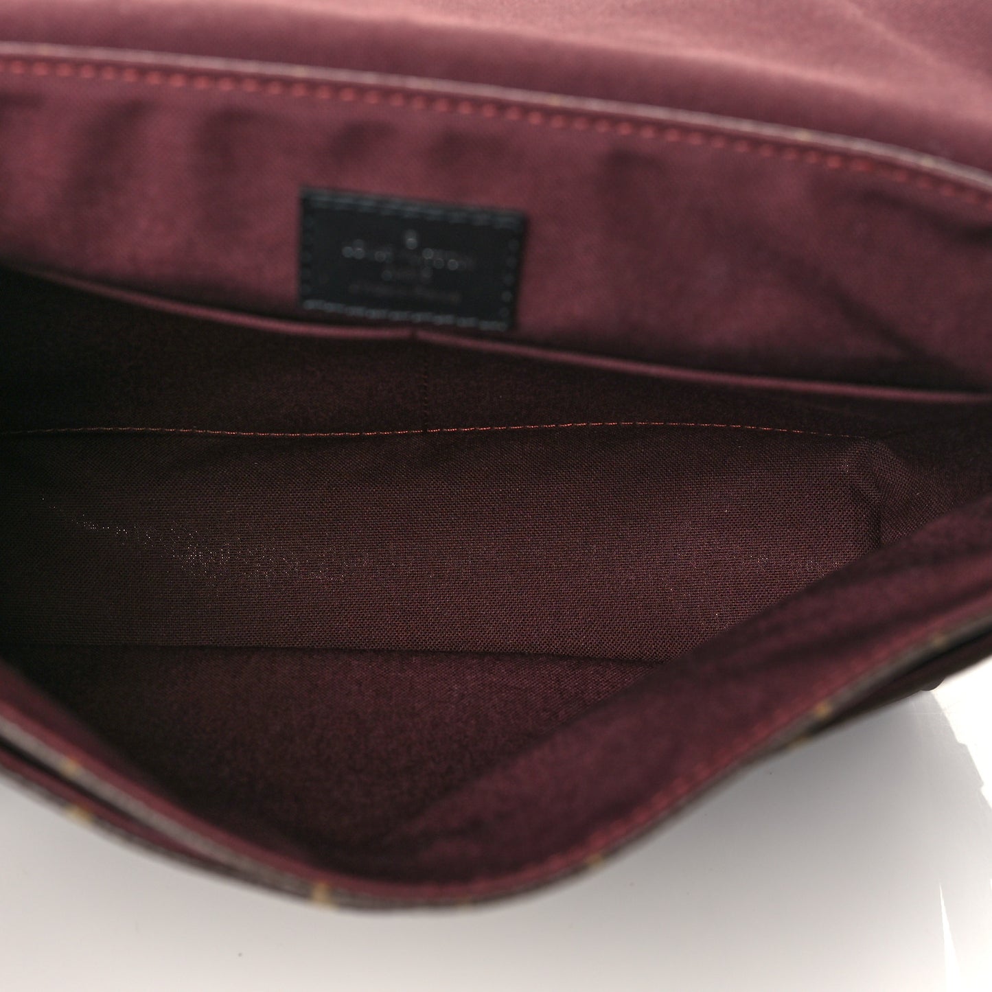 Monogram Macassar District PM