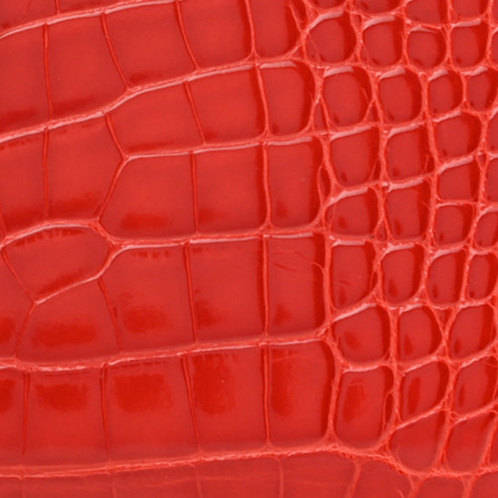 swatch of hermes geranium in shiny alligator FASHIONPHILE
