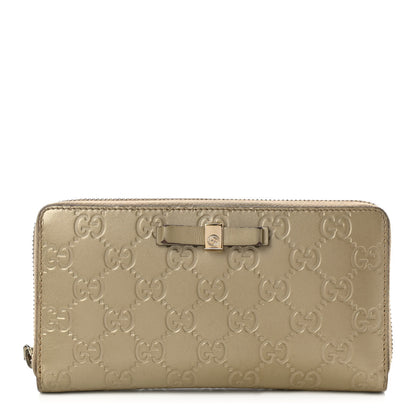 Gucci Metallic Guccissima Bow Zip Around Wallet Golden Beige 1 of 8