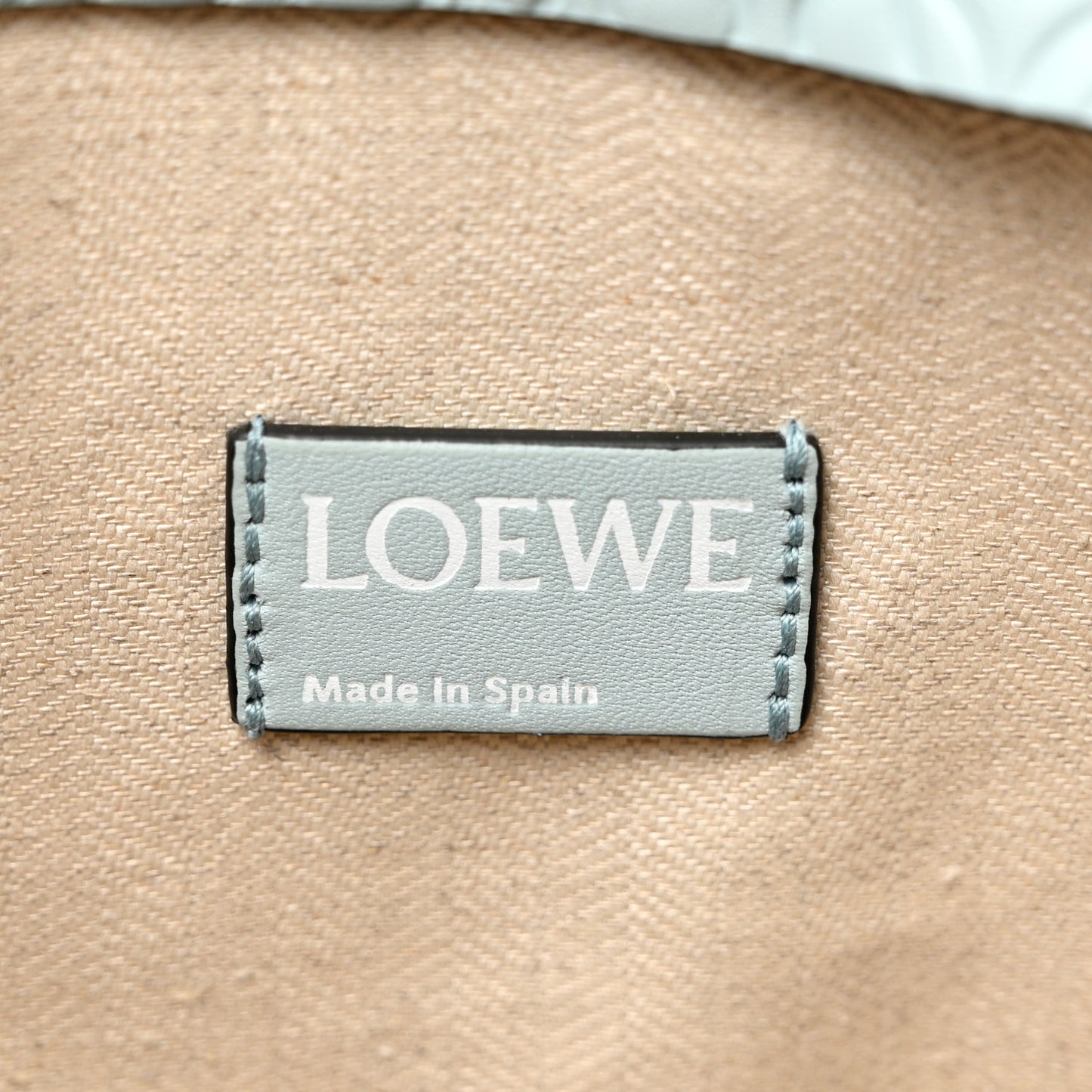 Calfskin Embossed Repeat T Pouch Light Blue