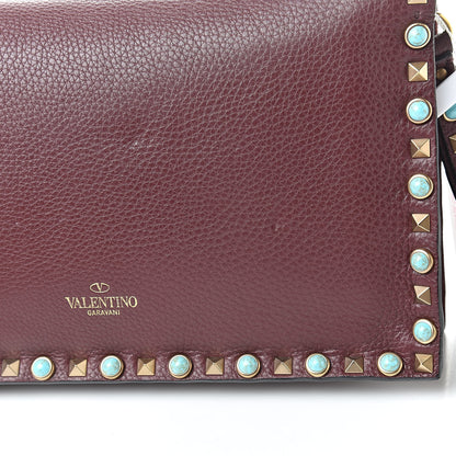 Valentino Garavani Pebbled Calfskin Rockstud Rolling Wristlet Clutch Rubin 11 of 11
