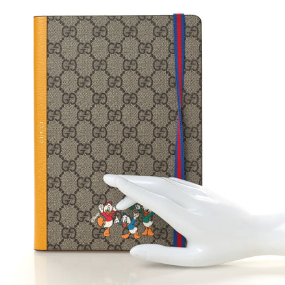 Gucci X DISNEY GG Supreme Monogram Textured Dollar Calfskin Donald Duck Notebook Beige Ebony Yellow 2 of 7