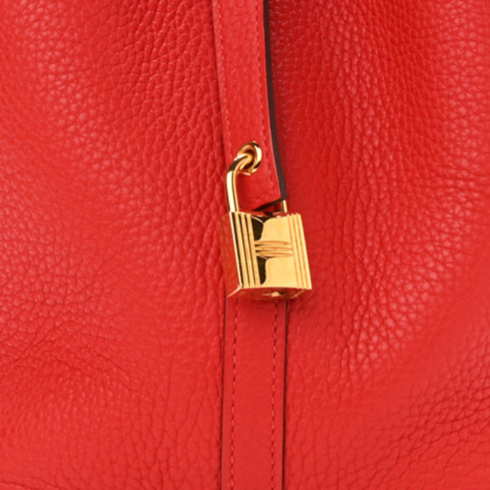swatch of hermes rouge tomate in taurillon clemence FASHIONPHILE