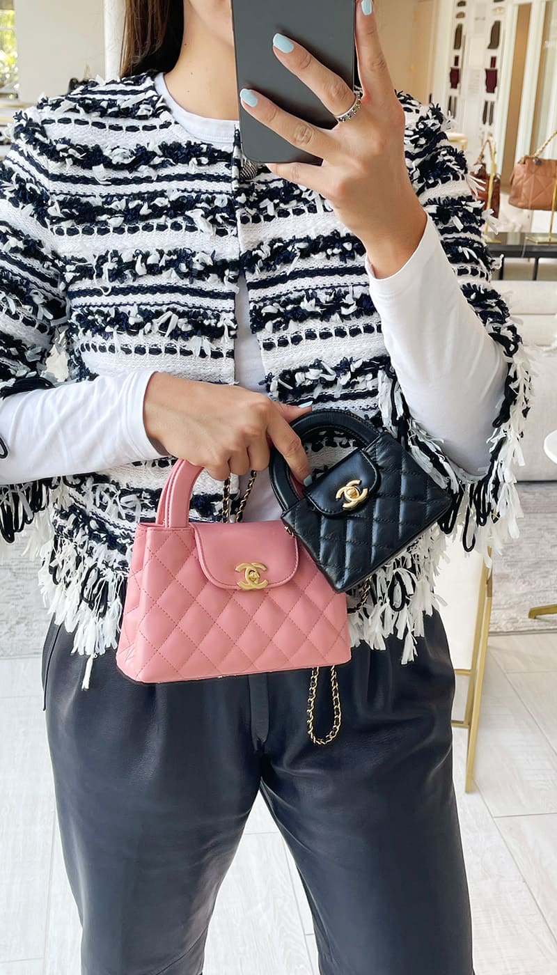 model holding chanel kelly bags on figure comparing the chanel nano kelly shopper and the mini nano kelly shopper by FASHIONPHILE
