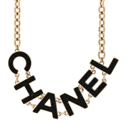 Chanel Crystal Cha-Nel Logo Chain Necklace Gold Black 1 of 5