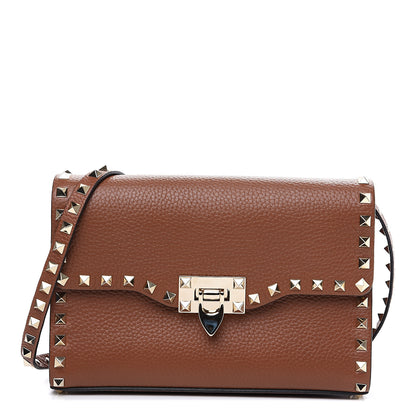 Valentino Garavani Pebbled Calfskin Medium Rockstud Flip Lock Crossbody Bag Bright Cognac 1 of 9