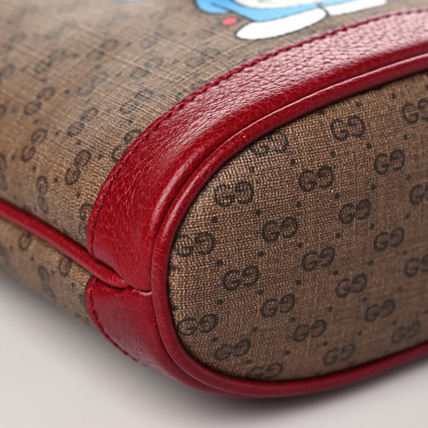 X DORAEMON Mini Vintage GG Supreme Monogram Textured Dollar Calfskin Mini Bucket Bag Beige Ebony Multicolor New Cherry Red
